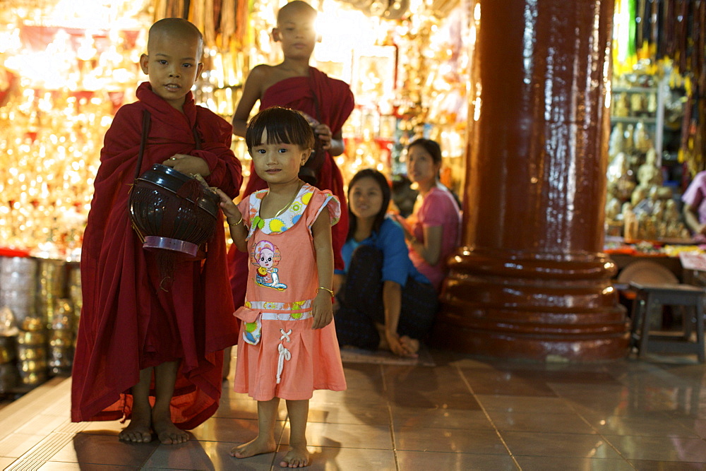 Very young monks in the gallery of the Paya Shwedagon temple in Yangon (Rangoon), Myanmar (Burma), Asia