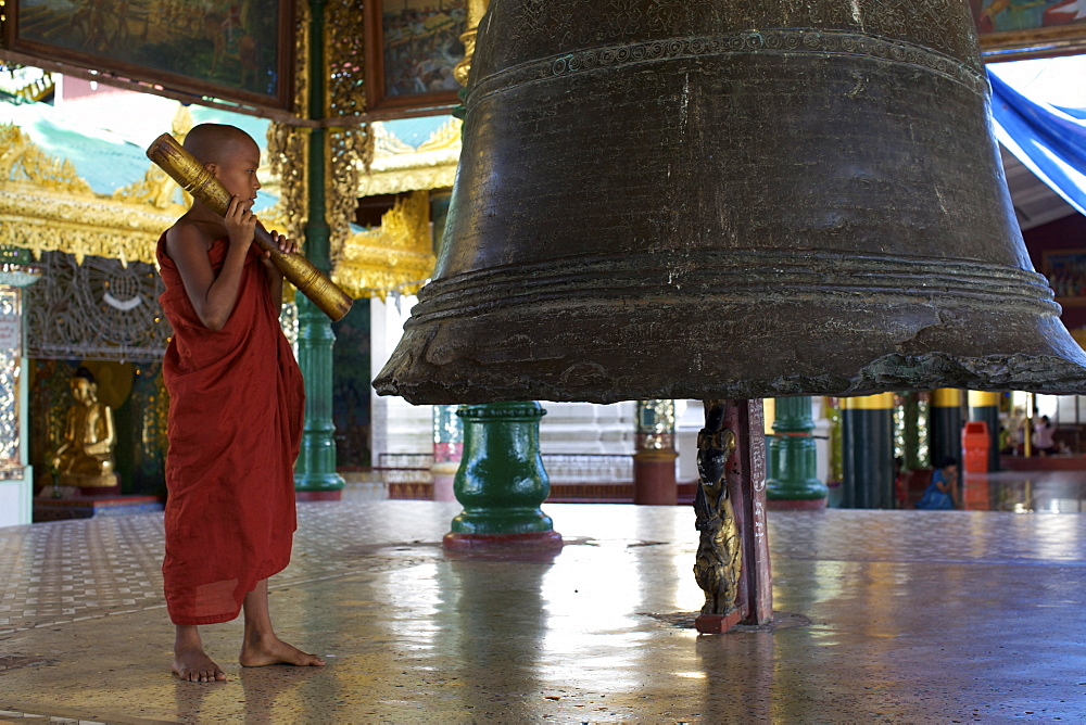 A young monk at the Paya Shwedagon temple in Yangon (Rangoon), Myanmar (Burma), Asia