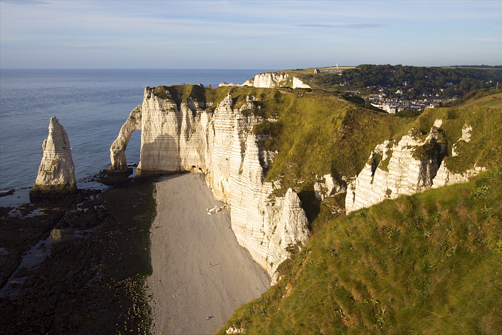 The pebble beach of the Aiguille of Etretat and the cliffs of the Cote d'Albatre, Seine Maritime, Normandy, France, Europe