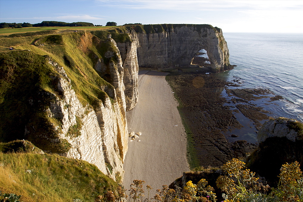 The pebble beach of Etretat and the limestone cliffs of the Cote d'Albatre, Seine Maritime,  Normandy, France, Europe