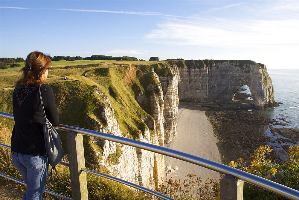 A pebble beach of Etretat and the limestone cliffs of the Cote d'Albatre, Seine Maritime, Normandy, France, Europe