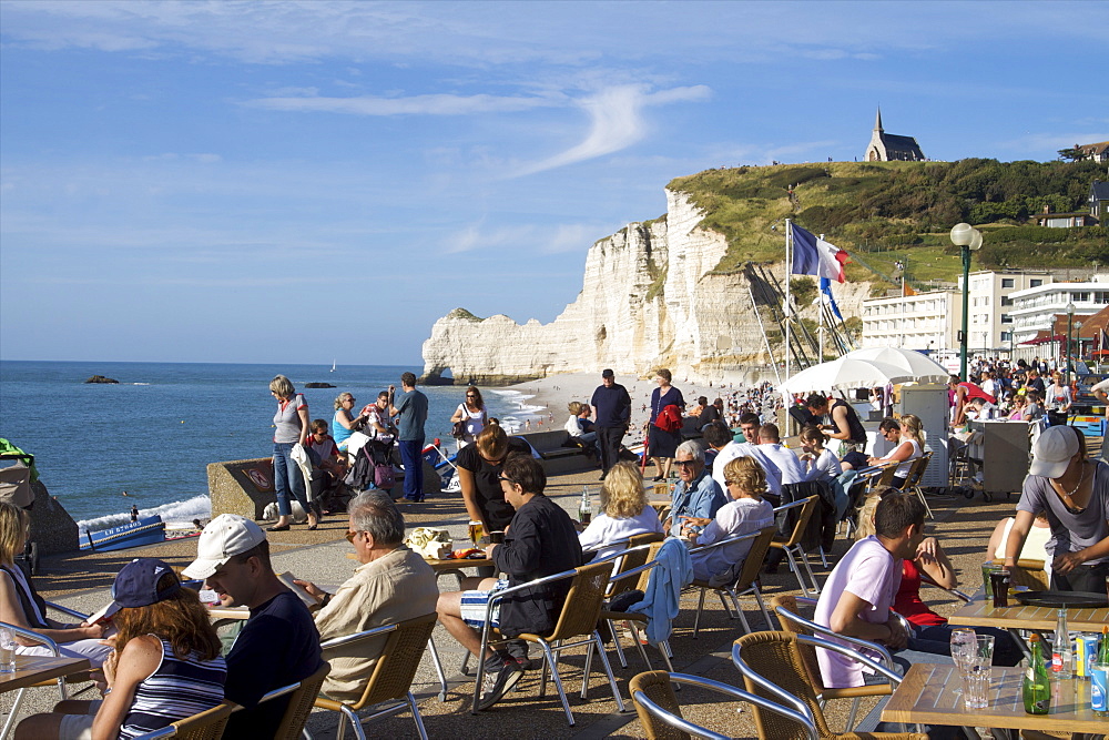 Having a drink on the sea front of Etretat in a boat bar, Etretat, Seine Maritime, Normandy, France, Europe