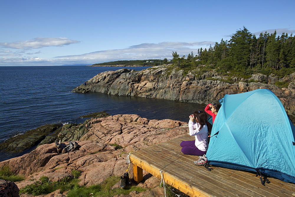 Campers whale watching on the shore of the St. Lawrence River, Quebec, Canada, North America