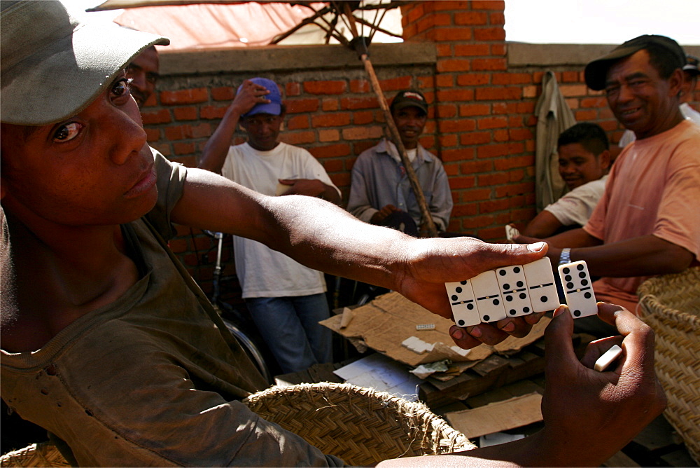 Domino players at the Antsirabe market, Madagascar, Africa