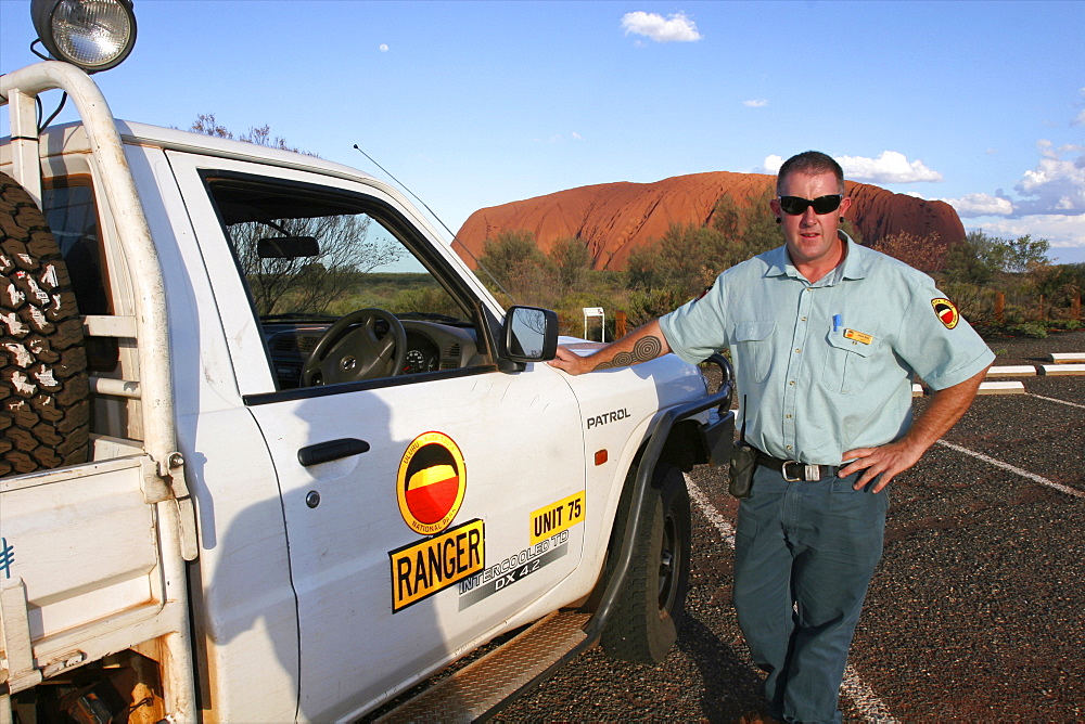 A ranger in front of Uluru (Ayers Rock) in the Red center, Northern Territories, Australia, Pacific