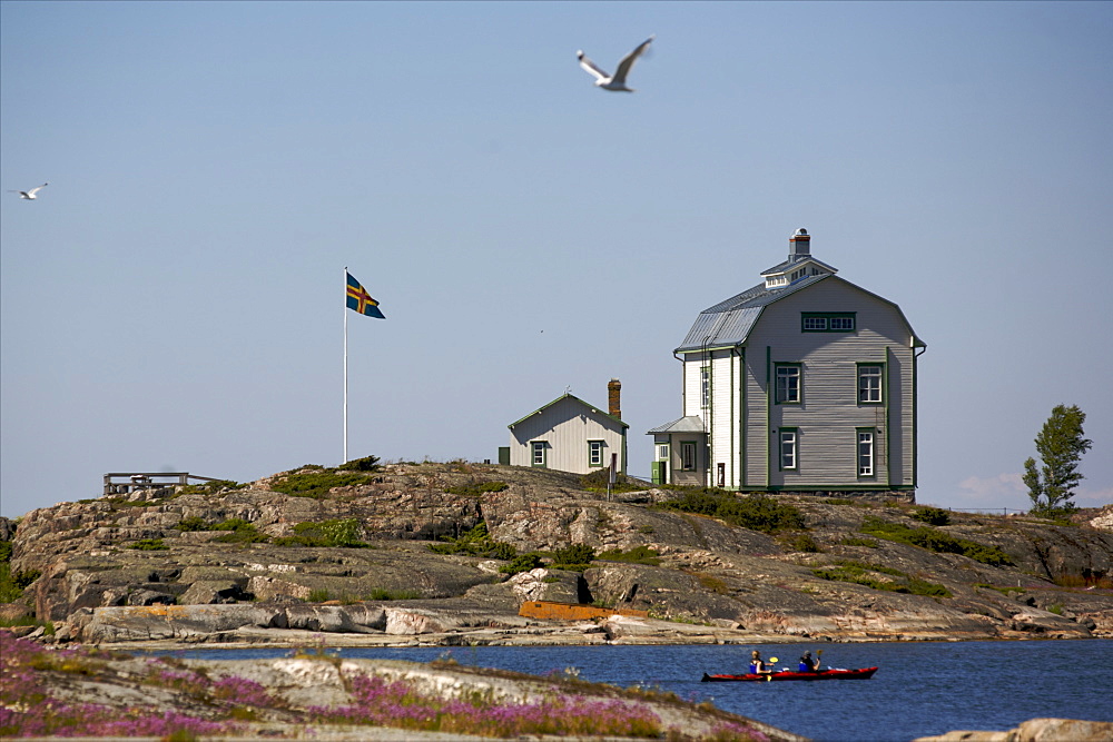 Canoeing along the coast of the Kobba Klintar island in the Aland archipelago, Finland, Scandinavia, Europe