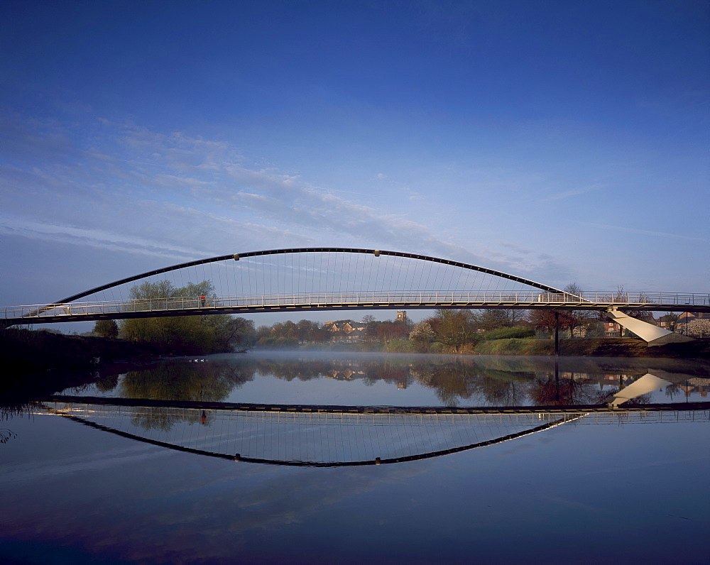 Millennium Bridge, pre-compressed arch footbridge, across the River Ouse at dawn, architects Whitby Bird Bridges, York, Yorkshire, England, United Kingdom, Europe