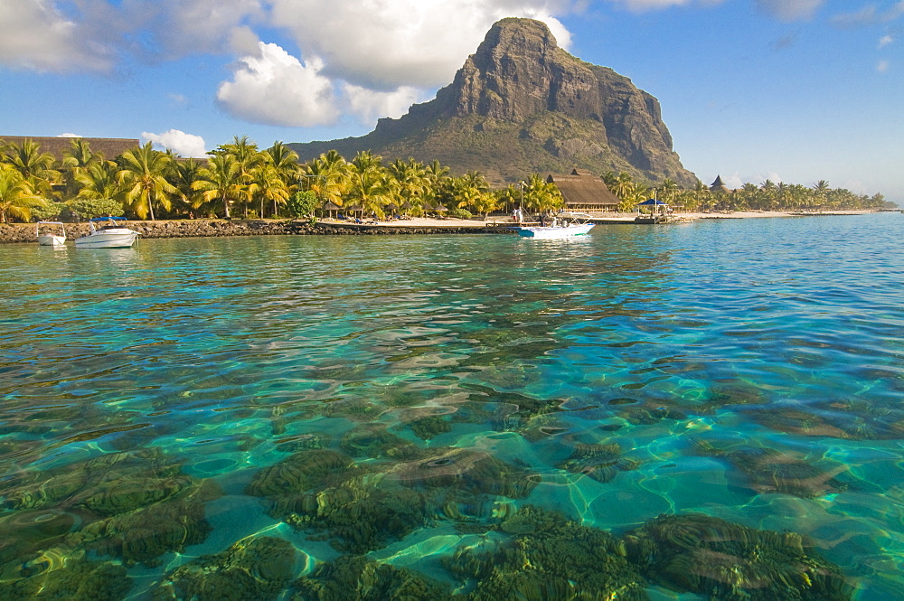 Turquoise water and the Beachcomber Le Paradis five star hotel, with Mont Brabant in the background, Mauritius, Indian Ocean, Africa