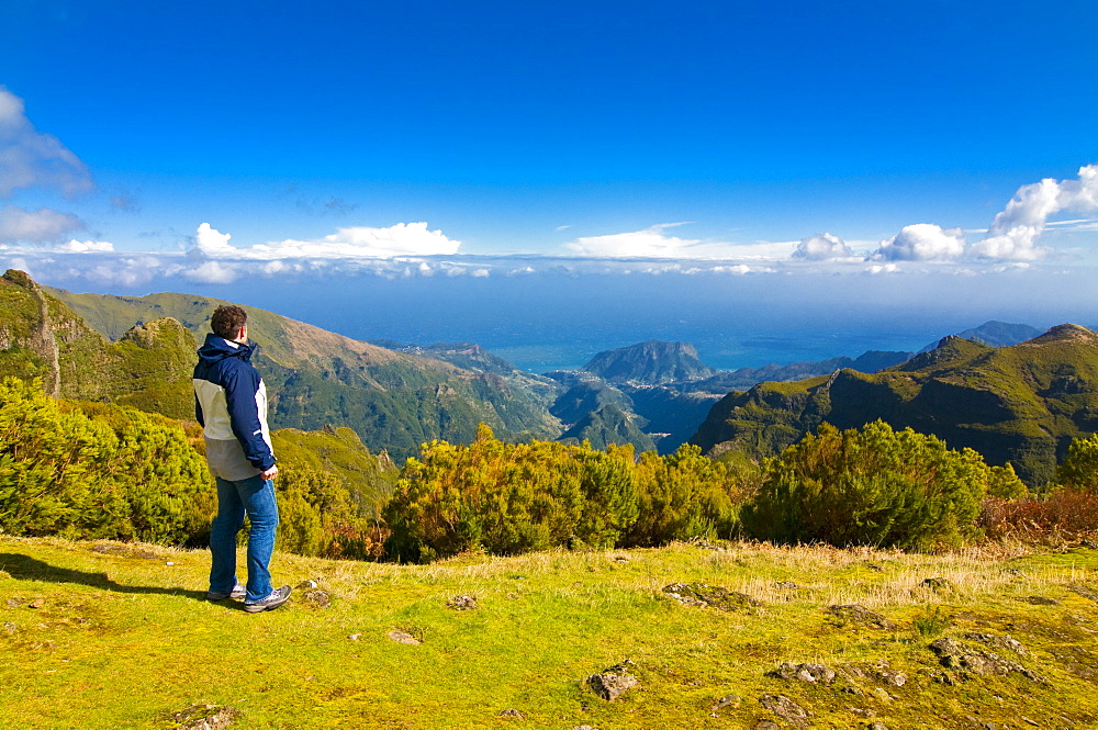 Tourist looking at the stunning scenery of Pico de Ariero, Madeira, Portugal, Europe