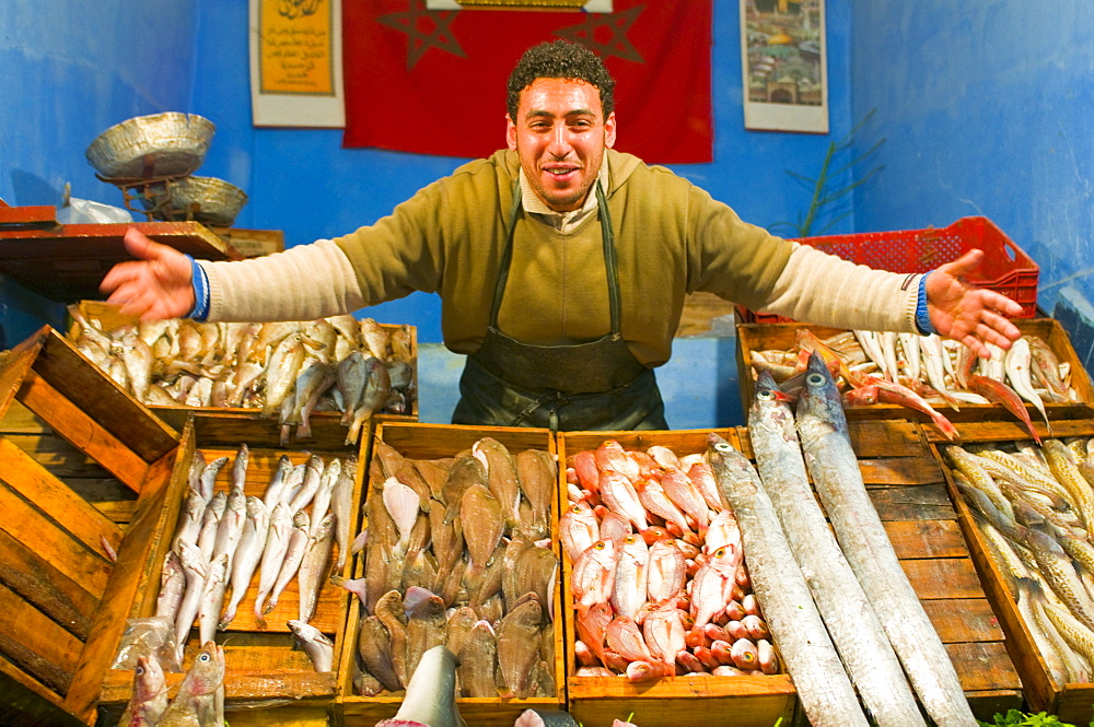 Man selling fish in the bazaar of Meknes, Morocco, North Africa, Africa