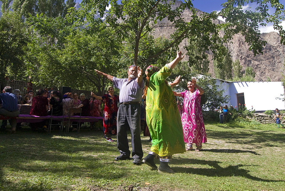 People dance at a traditional Pamiri wedding, Bartang valley, Tajikistan, Central Asia, Asia