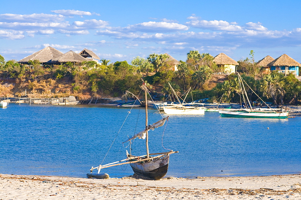 Outrigger boat lying on bank of sand, Antsanitian Beach Resort, Mahajanga, Madagascar, Indian Ocean, Africa