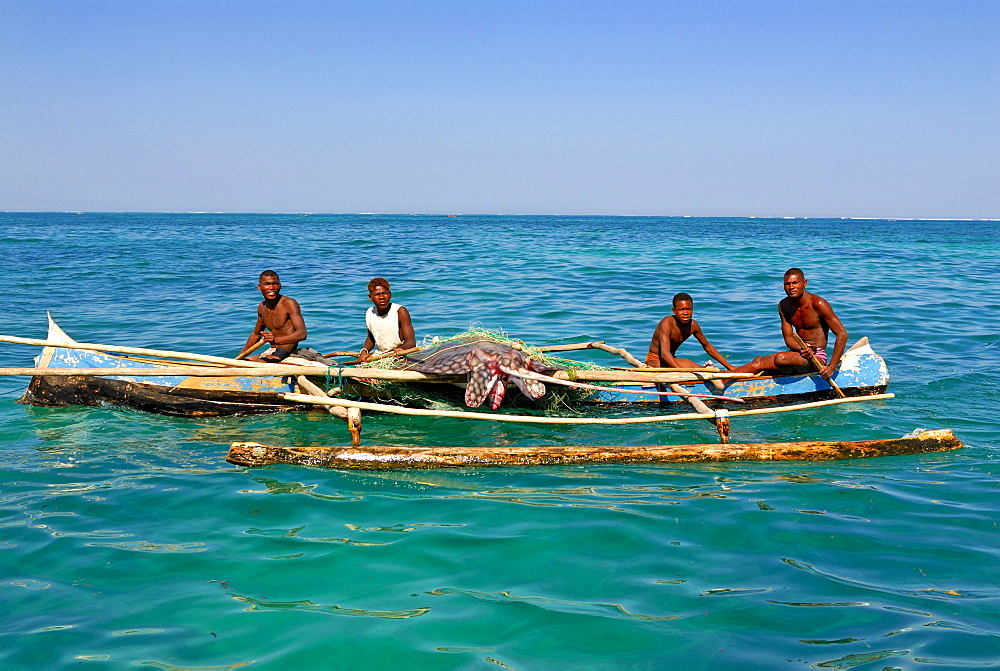 Traditional rowing boat in the turquoise water of the Indian Ocean, Madagascar, Africa