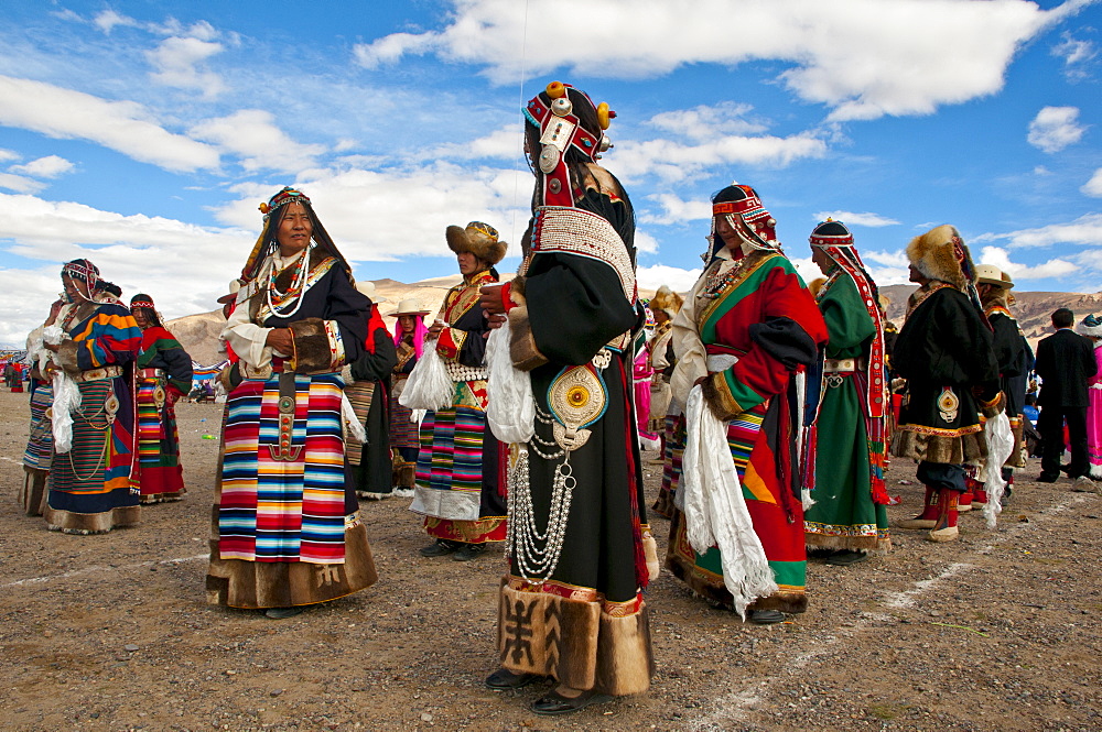 Traditionally dressed Tibetans participating at a local festival, Gerze, Tibet, China, Asia