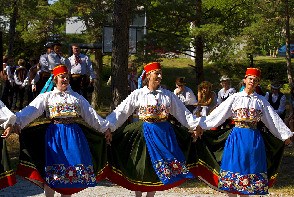 Traditionally dressed women dancing at folk show at Saaremaa Island, Estonia, Baltic States, Europe