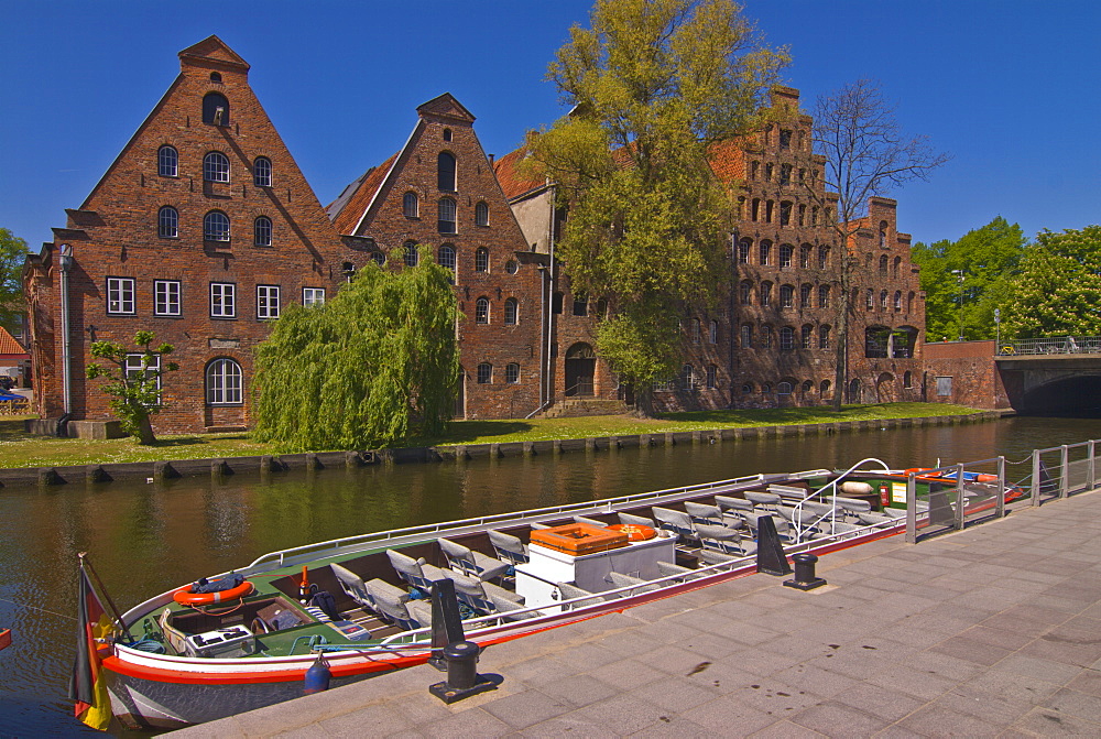 Boat on a little channel in front of the salt warehouses, Lubeck, UNESCO World Heritage Site, Schleswig-Holstein, Germany, Europe