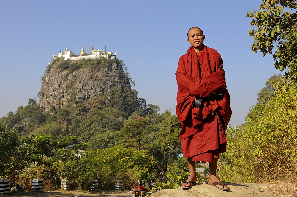 Monk in front of the Buddhist monastery on Mount Popa, Myanmar, Asia