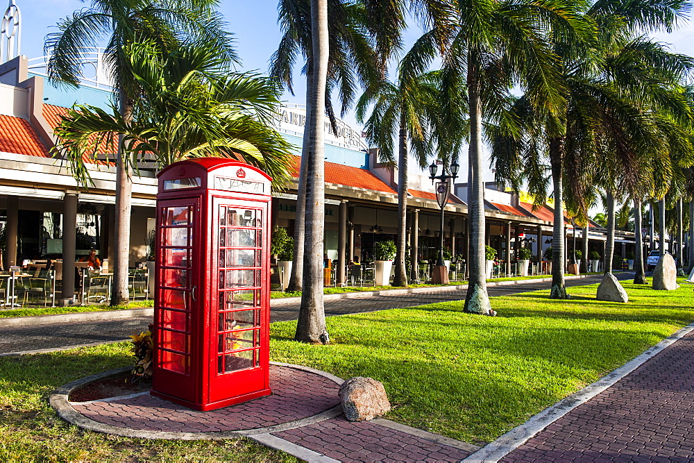 Red telephone box in downtown Oranjestad, capital of Aruba, ABC Islands, Netherlands Antilles, Caribbean, Central America