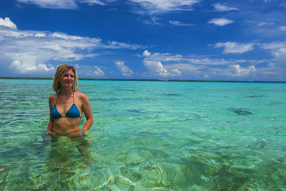 Tourist in the incredible blue waters of the Ant Atoll, Pohnpei, Micronesia, Pacific