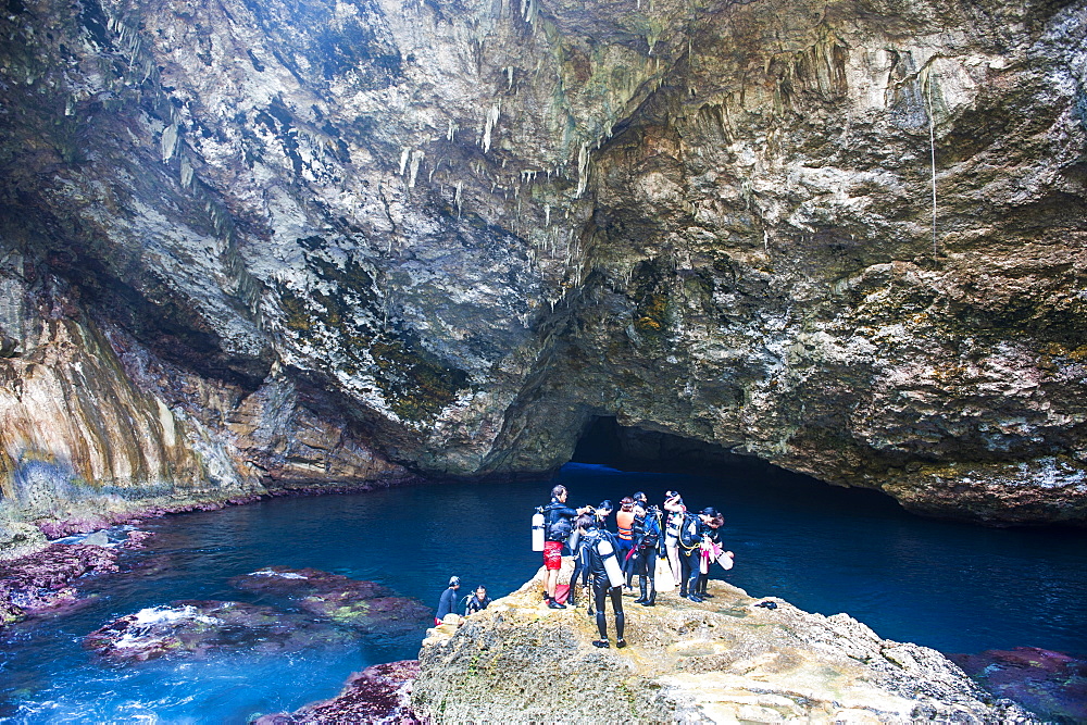 Divers preparing for dive in the grotto collapsed cave on Saipan, Northern Marianas, Central Pacific, Pacific