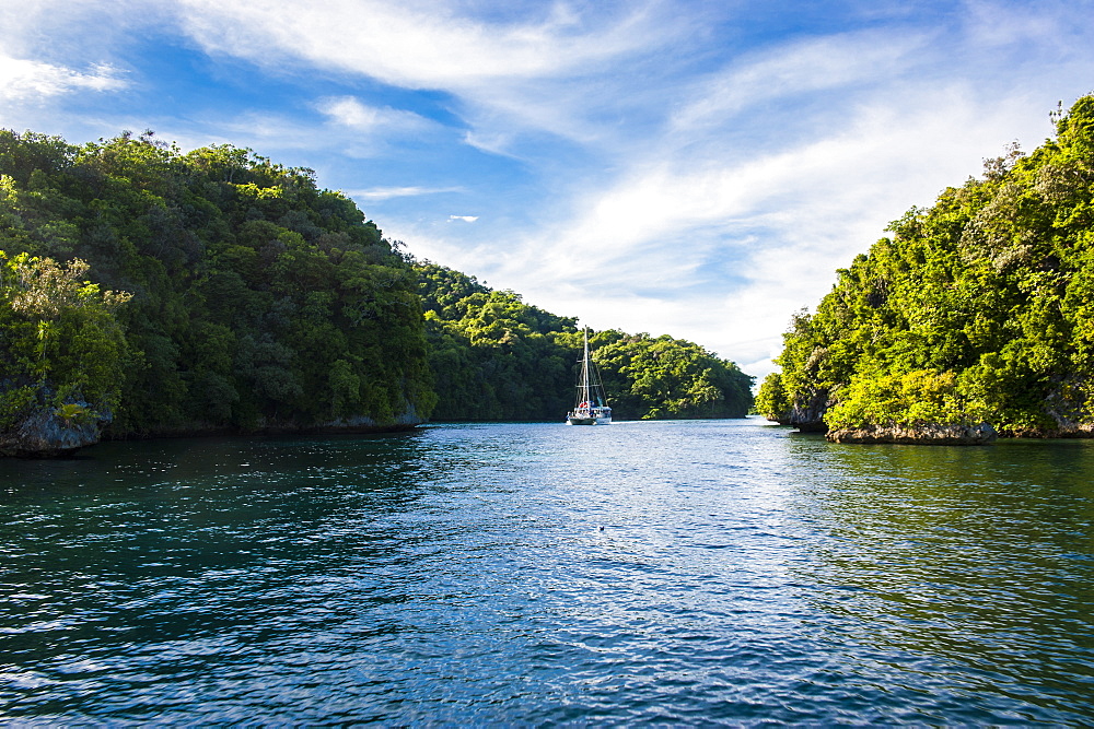 Sailing boat leaving the habour of Koror, Rock islands, Palau, Central Pacific, Pacific