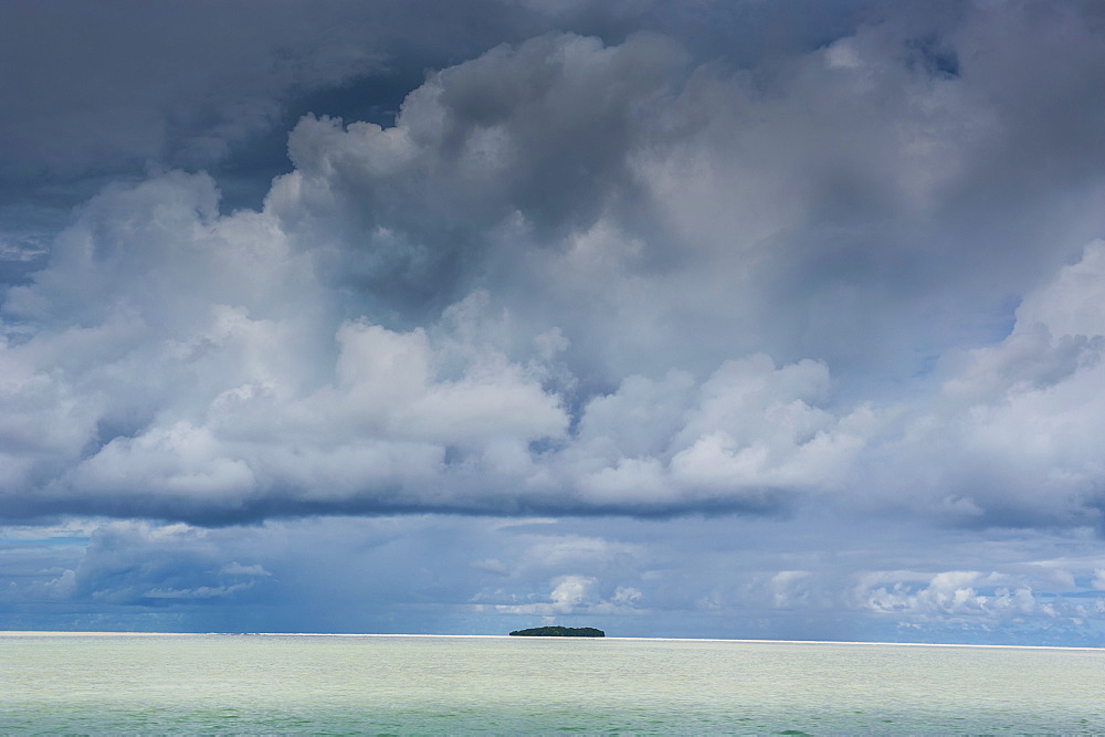 Dramatic sky over a little island in the Rock islands, Palau, Central Pacific, Pacific