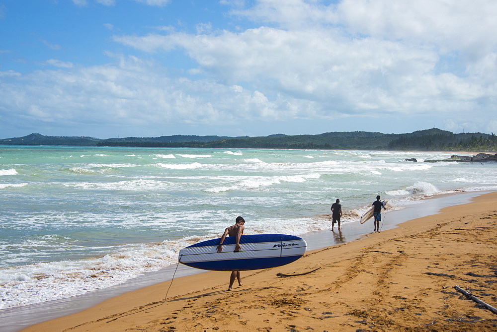 Surfer on Luquillo Beach, Puerto Rico, West Indies, Caribbean, Central America