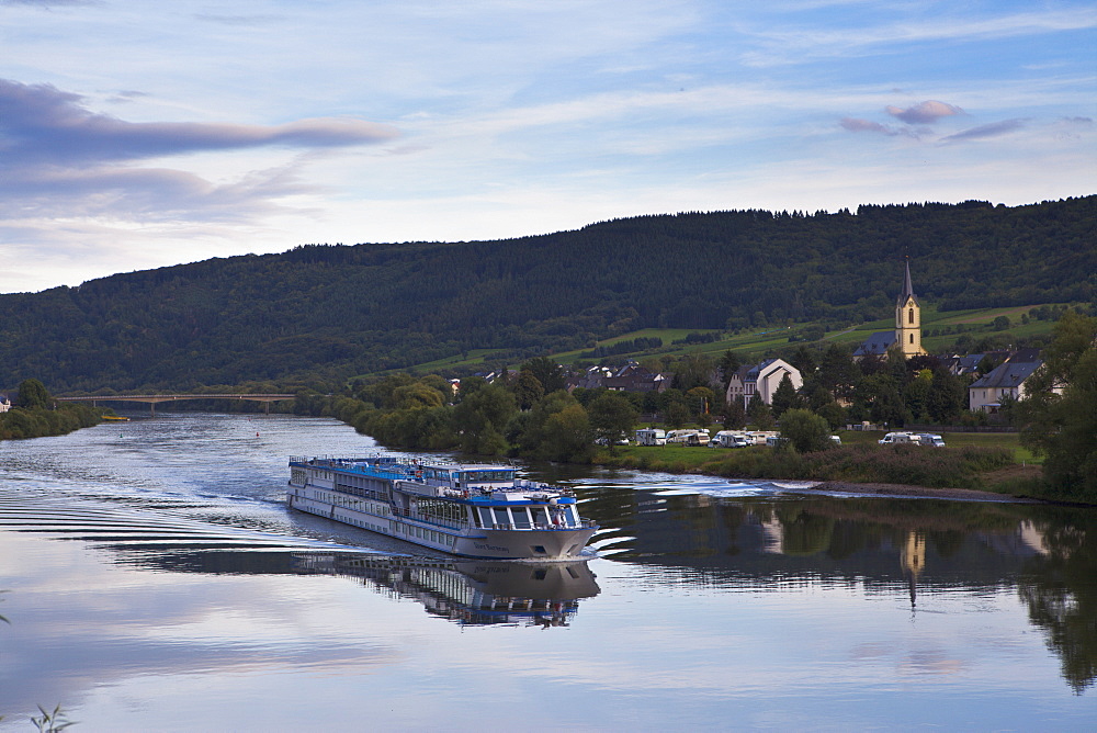 River cruise ship on the Moselle River in the late afternoon light, Germany, Europe