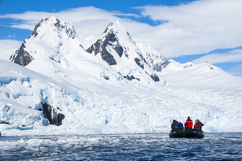 Tourists in a Zodiac in front of glaciers in Cierva Cove, Antarctica, Polar Regions