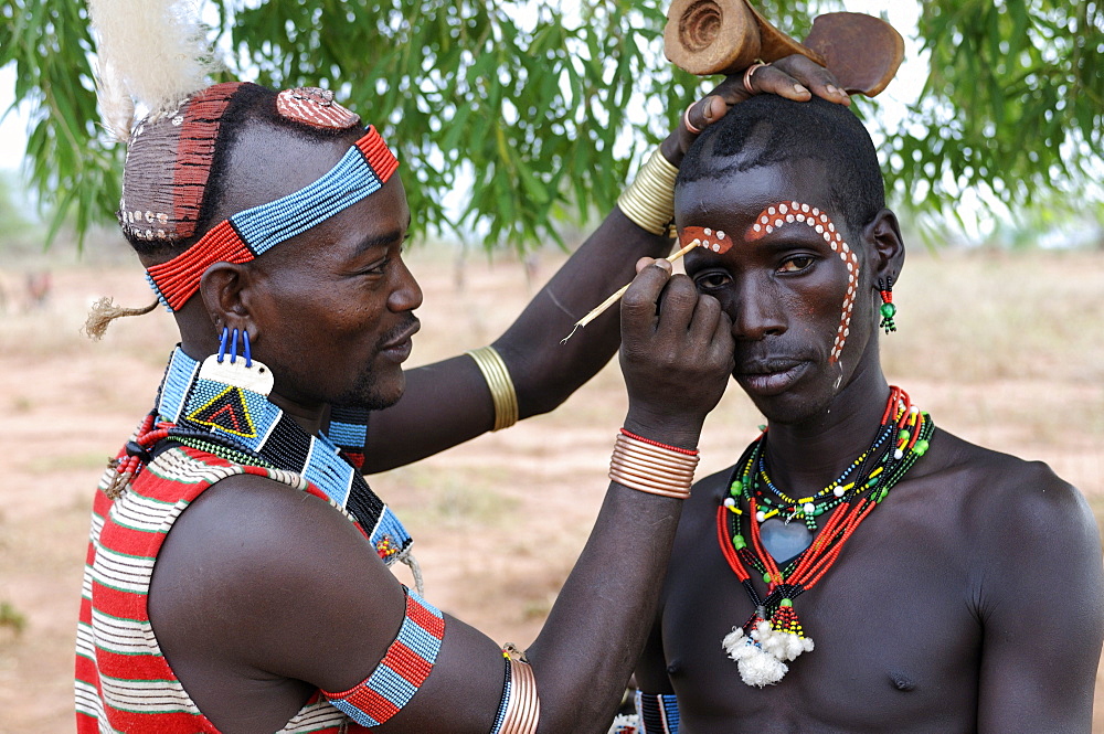 Two men from the Hamer tribe preparing for the Jumping of the Bull ceremony, Omo Valley, Southern Ethiopia, Ethiopia, Africa