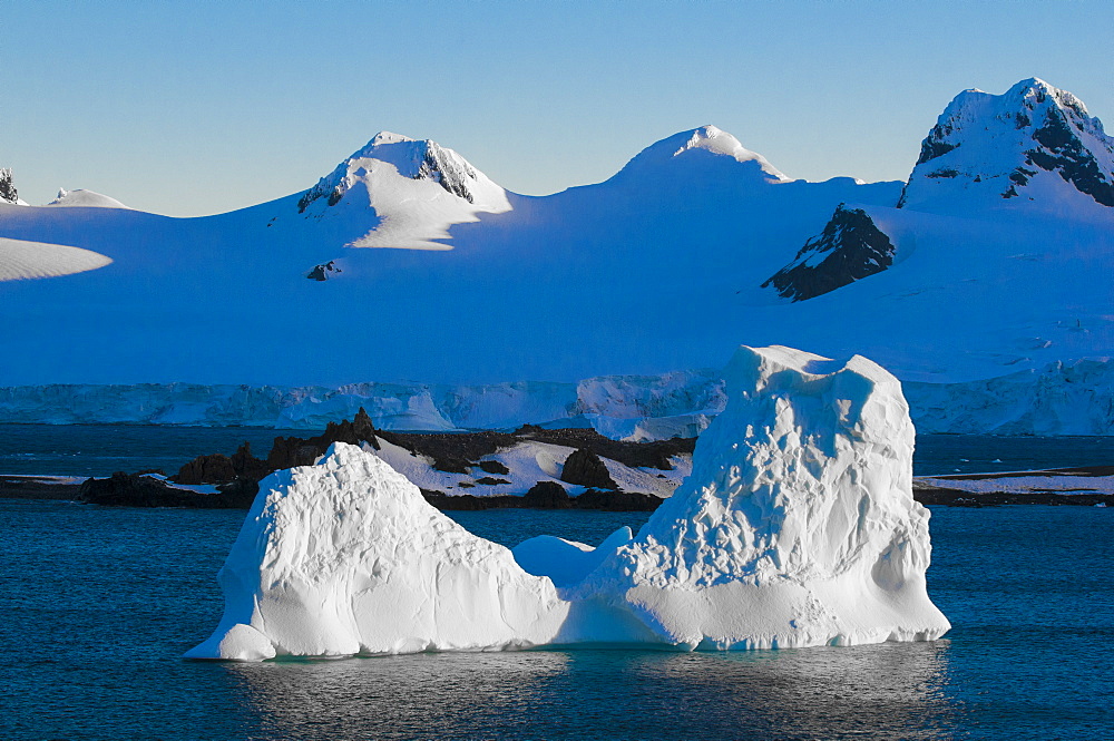 Iceberg illuminated in the sun, Half Moon Bay, South Shetland Islands, Antarctica, Polar Regions 