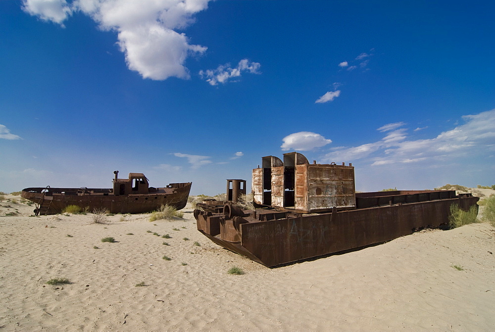 Rusting boats lying in the desert which used to be the Aral Sea, Moynaq, Uzbekistan, Central Asia, Asia