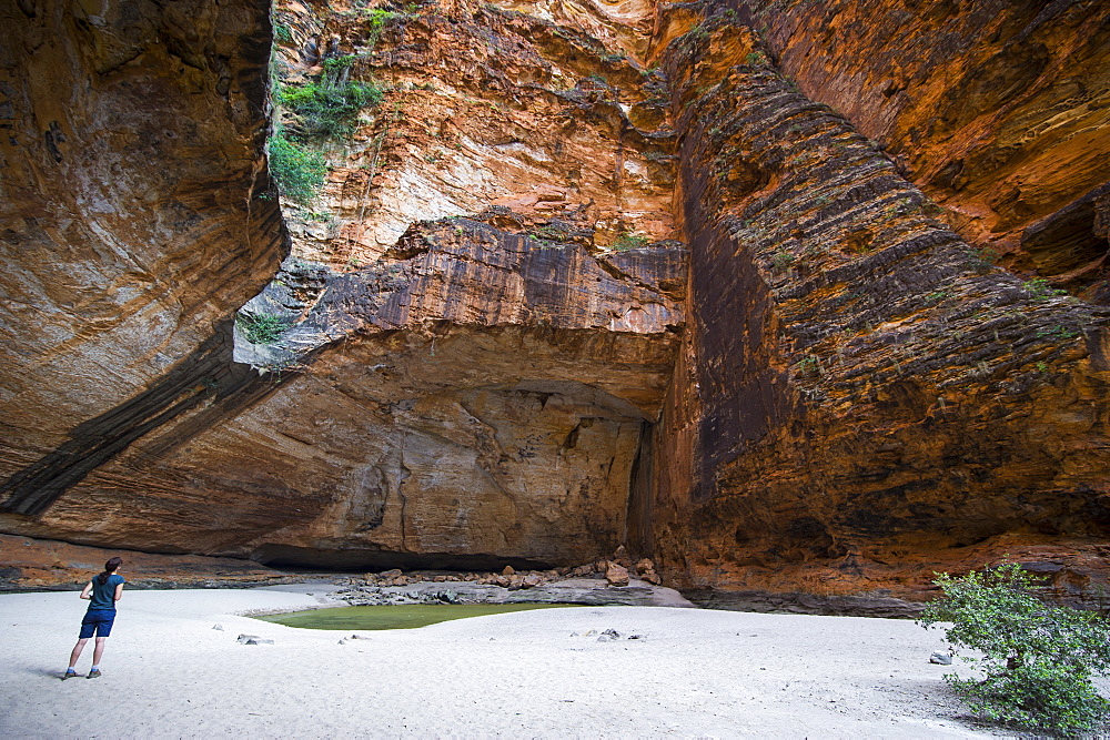 Woman in the Cathedral Gorge in the Purnululu National Park, UNESCO World Heritage Site, Bungle Bungle mountain range, Western Australia, Australia, Pacific