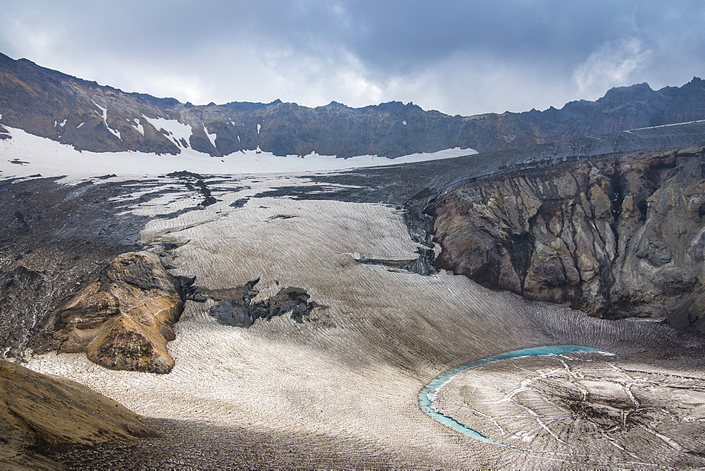 Blue glacial water in a glacier on Mutnovsky volcano, Kamchatka, Russia, Eurasia  