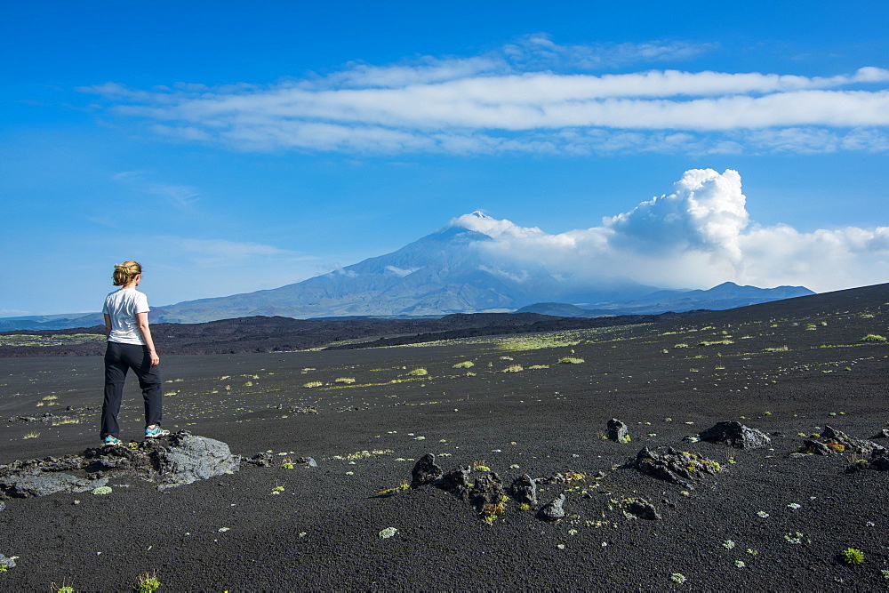 Woman watching Tolbachik volcano, Kamchatka, Russia, Eurasia 