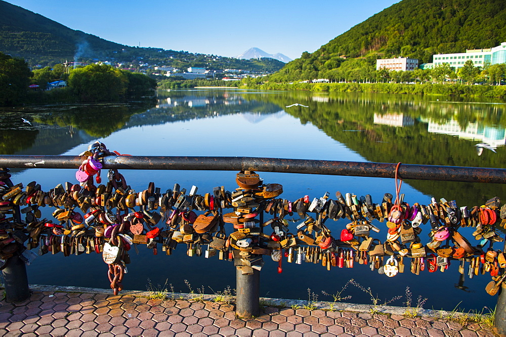 Lots of padlocks and chains on a handrail above an artifical lake in Petropavlovsk-Kamchatsky, Kamchatka, Russia, Eurasia 