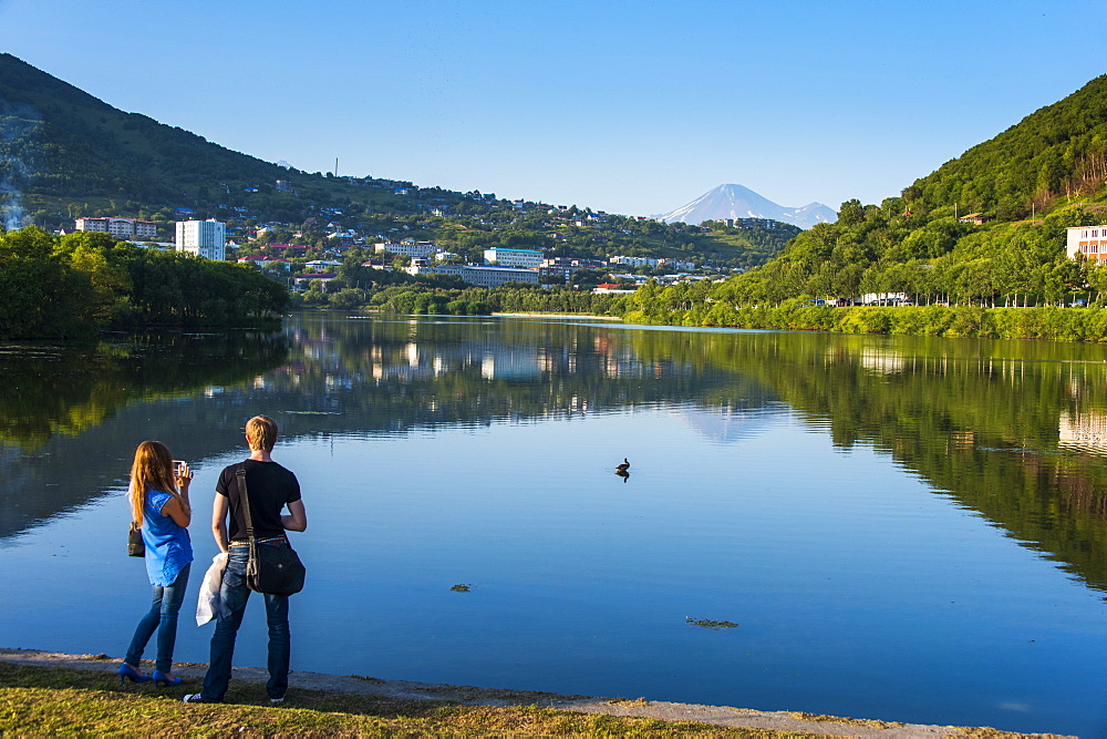 Tourists standing on an artifical lake in the harbour of Petropavlovsk-Kamchatsky, Kamchatka, Russia, Eurasia