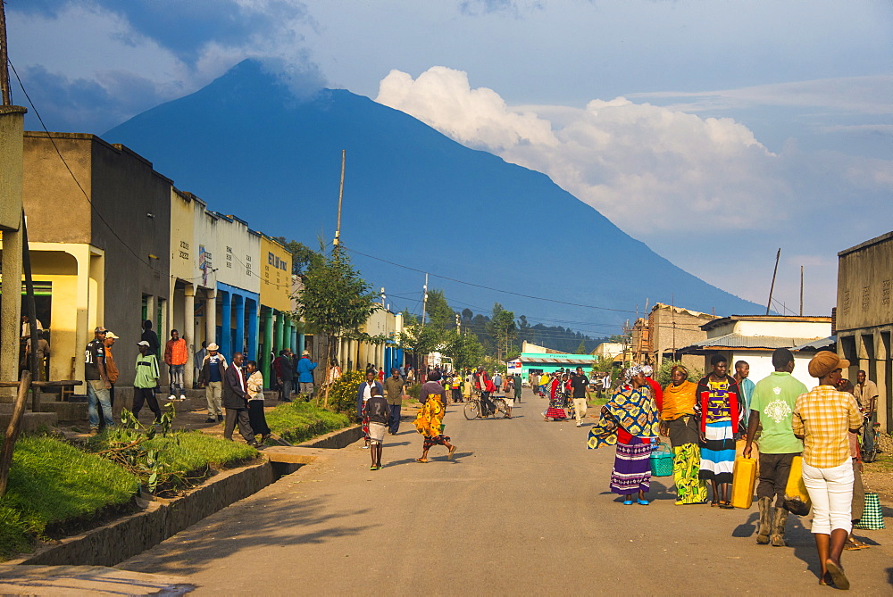 Little village before the towering volcanoes of the Virunga National Park, Rwanda, Africa