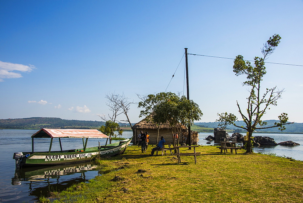 Tourist boat anchoring on a little island at the source of the Nile, where the Nile starts, Jinja, Uganda, East Africa, Africa