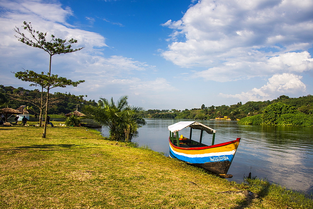 Tourist boat anchoring on a little island at the source of the Nile, where the Nile starts, Jinja, Uganda, East Africa, Africa