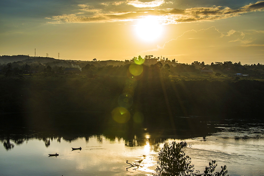 Fishermen in their canoes fishing at sunset on the Nile at Jinja, source of the Nile, Uganda, East Africa, Africa