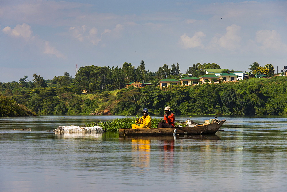 Local fisherman in a dugout canoe in Jinja, Uganda, East Africa, Africa