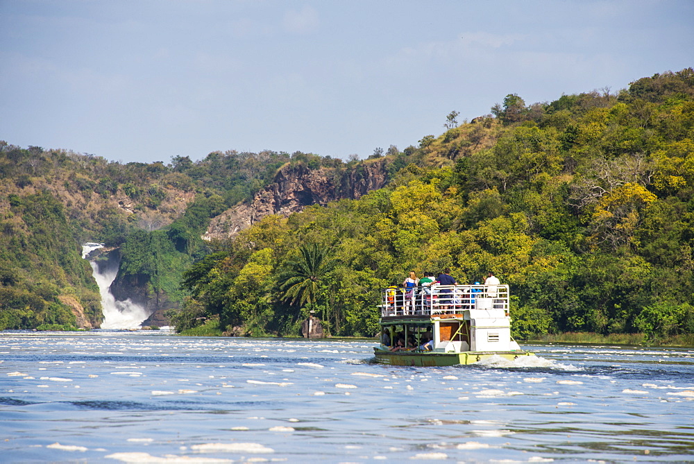 Tourist boat cruising the Nile in front of the Murchison Falls (Kabarega Falls) on the Nile, Murchison Falls National Park, Uganda, East Africa, Africa