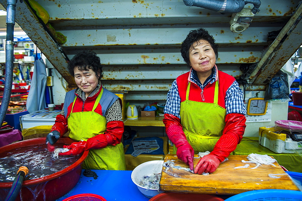 Women selling fish at the modern fish market in Busan, South Korea, Asia