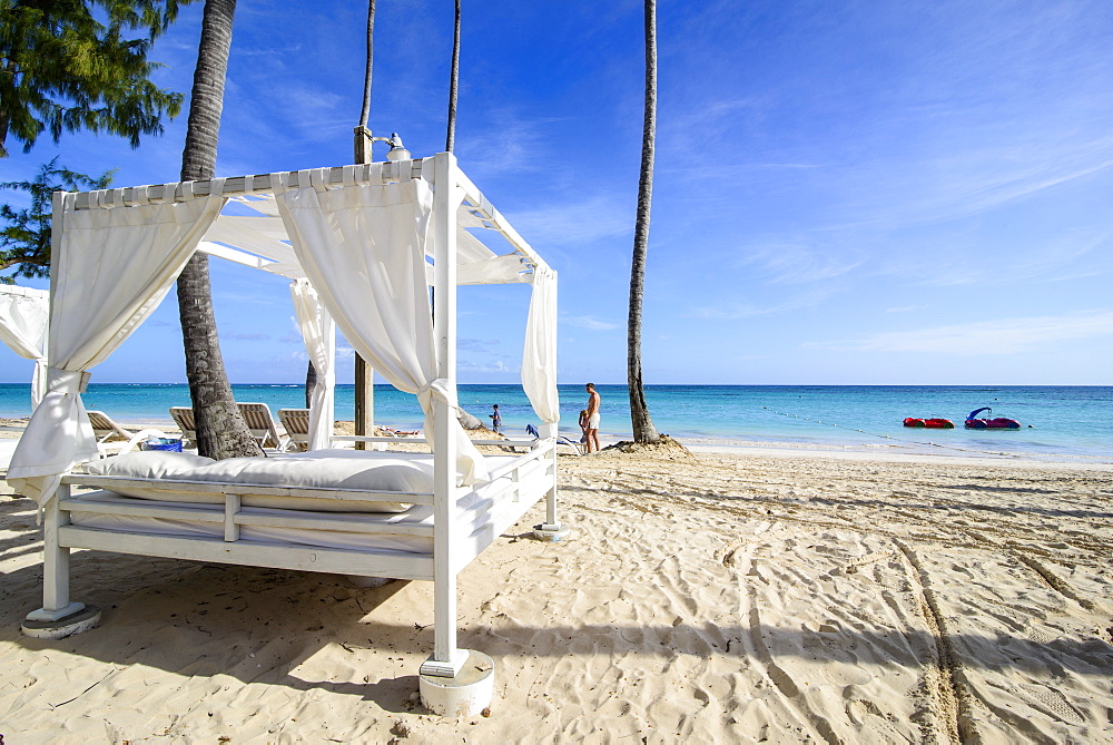 Four poster bed on the beach of Bavaro, Punta Cana, Dominican Republic, West Indies, Caribbean, Central America