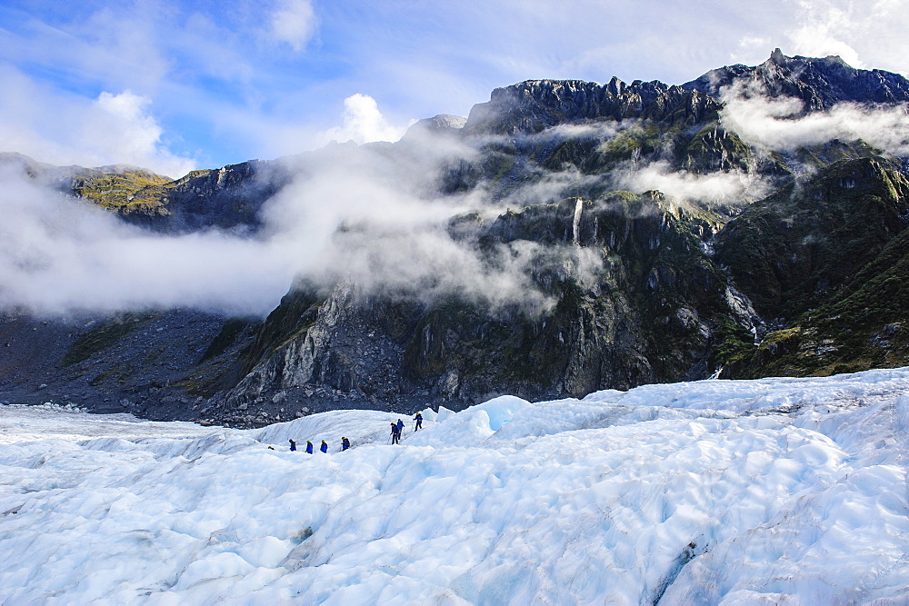 Tourist hiking on Fox Glacier, Westland Tai Poutini National Park, South Island, New Zealand, Pacific