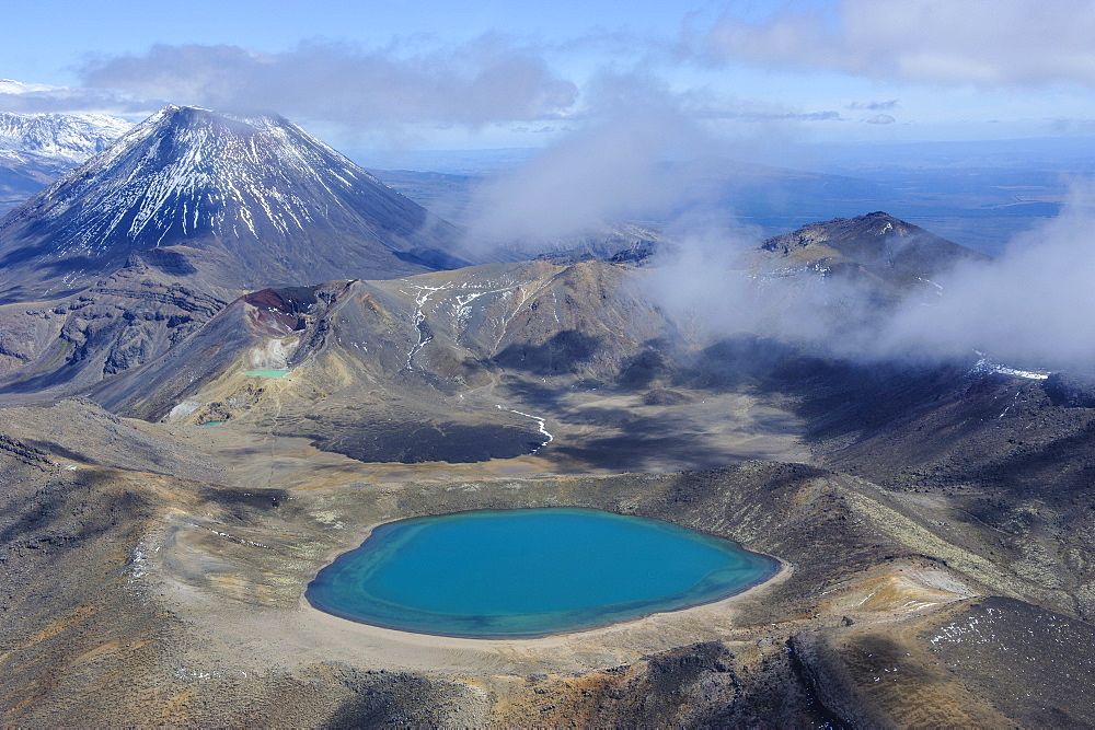 Aerial of a blue lake with Mount Ngauruhoe in the background, Tongariro National Park, UNESCO World Heritage Site, North Island, New Zealand, Pacific