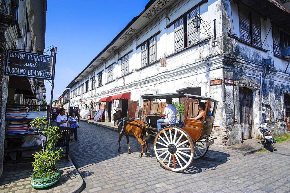 Horse cart riding through the Spanish colonial architecture in Vigan, UNESCO World Heritage Site, Northern Luzon, Philippines, Southeast Asia, Asia