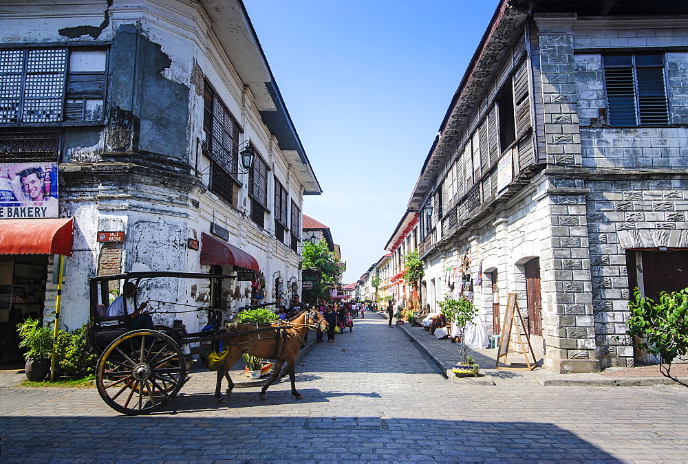 Horse cart riding through the Spanish colonial architecture in Vigan, UNESCO World Heritage Site, Northern Luzon, Philippines, Southeast Asia, Asia