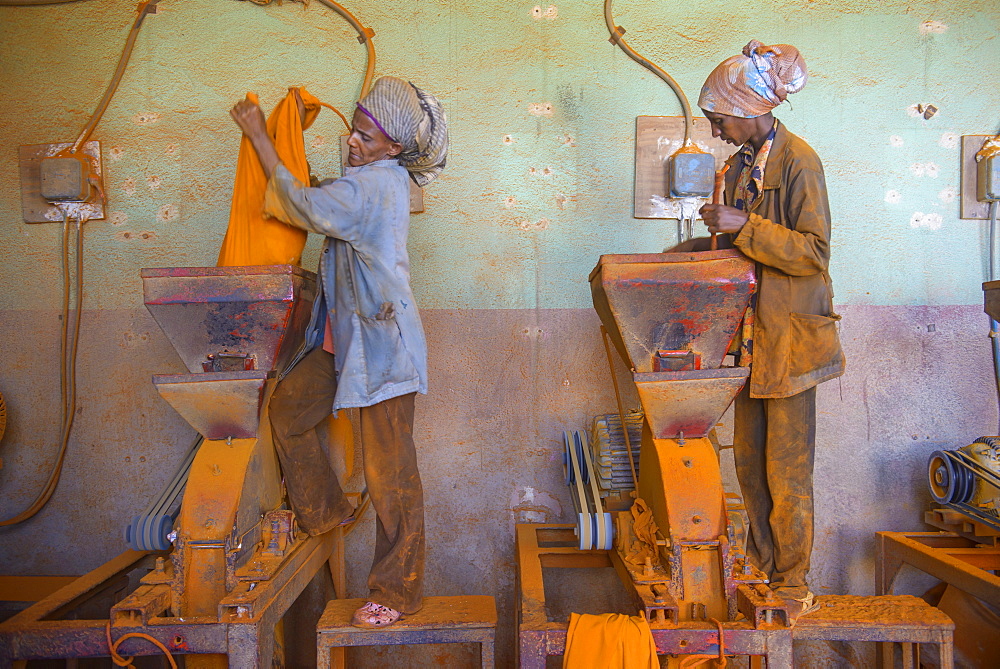 Women working in a Berbere red pepper spice factory at the Medebar market, Asmara, capital of Eritrea, Africa